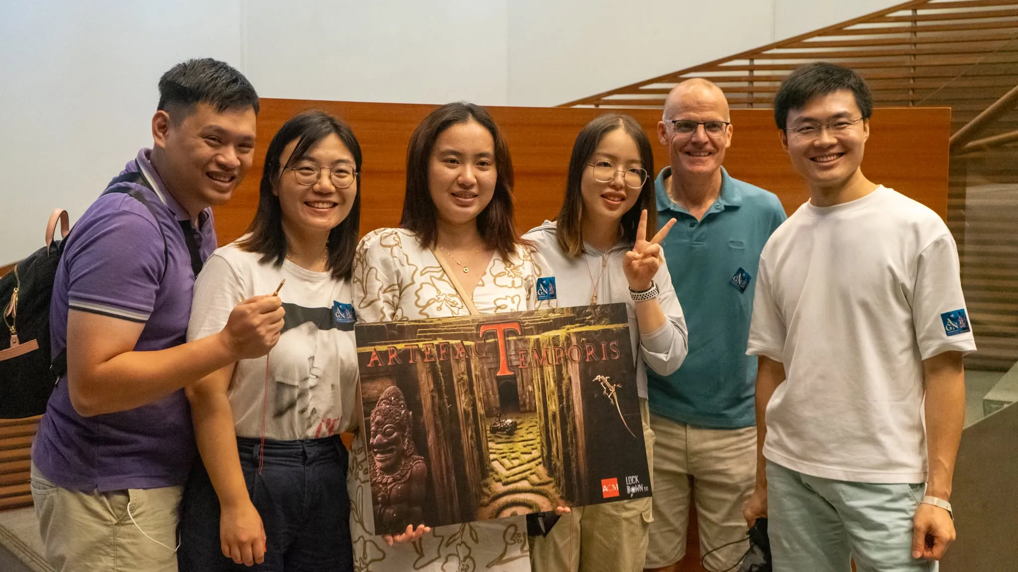 A corporate team celebrating after finishing Artefact Temporis at the Asian Civilisations Museum